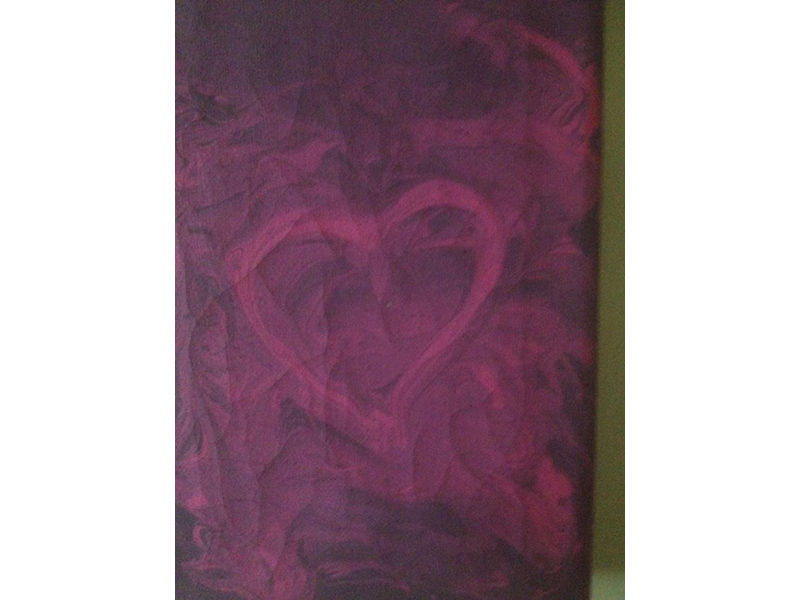 a purple finger paint heart